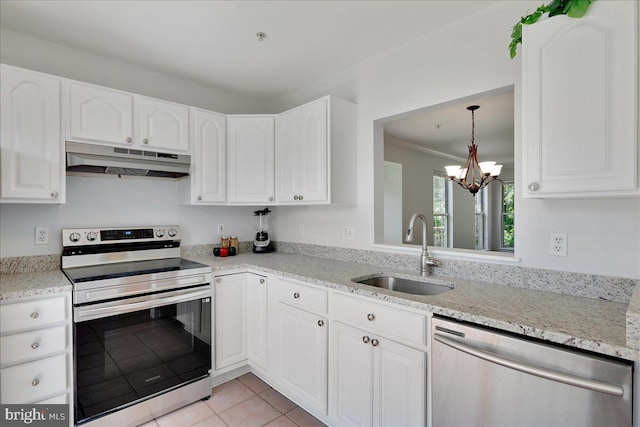 2222 Commissary Cir Unit 198, Odenton, MD 21113 - kitchen with appliances with stainless steel finishes, under cabinet range hood, a chandelier, white cabinetry, and light tile patterned floors