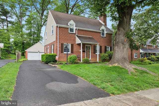 515 Marks Rd, Oreland, PA 19075 - view of front of home featuring a garage, an outbuilding, a chimney, brick siding, and a front lawn
