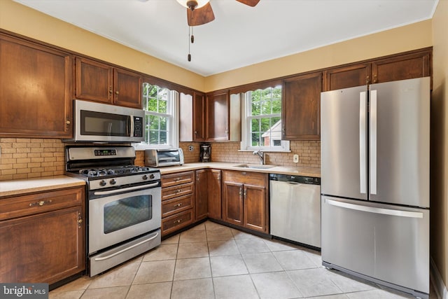 515 Marks Rd, Oreland, PA 19075 - kitchen with stainless steel appliances, a ceiling fan, light countertops, and backsplash