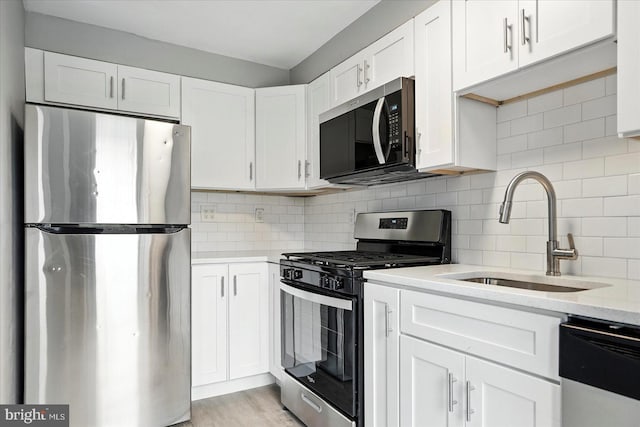 8206 Boundary, Baltimore, MD 21222 - kitchen with stainless steel appliances, white cabinetry, and tasteful backsplash