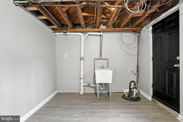 8206 Boundary, Baltimore, MD 21222 - finished basement with a sink and light wood-type flooring