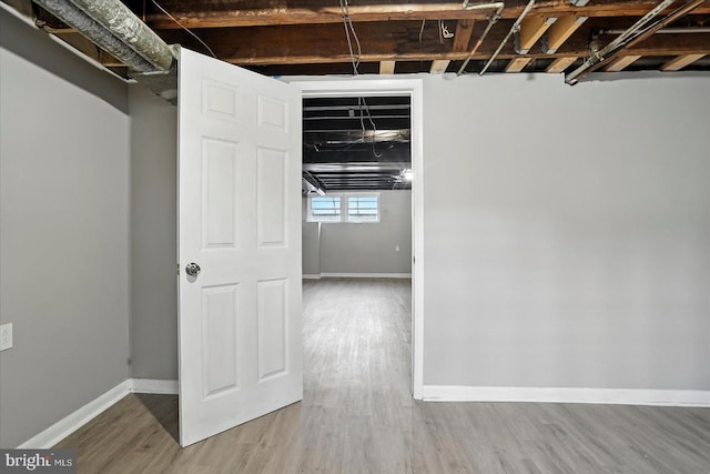 8206 Boundary, Baltimore, MD 21222 - below grade area featuring wood finished floors and baseboards
