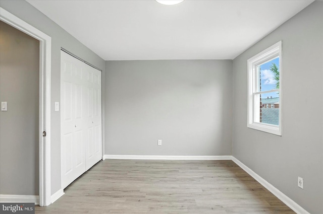 8206 Boundary, Baltimore, MD 21222 - unfurnished bedroom with light wood-type flooring and a closet