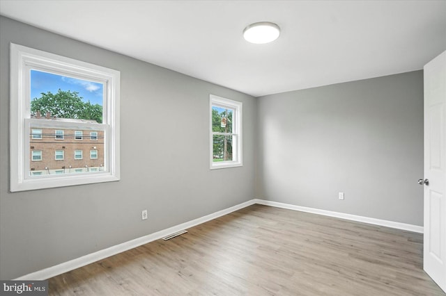 8206 Boundary, Baltimore, MD 21222 - spare room featuring baseboards and light wood-style flooring