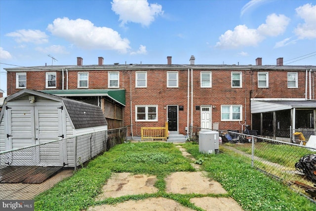8206 Boundary, Baltimore, MD 21222 - back of property with a storage unit and brick siding