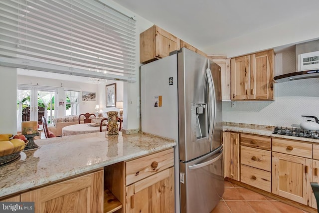 1312 Cedar Park Rd, Annapolis, MD 21401 - kitchen featuring stainless steel refrigerator with ice dispenser, light brown cabinetry, black gas cooktop, and light tile patterned flooring