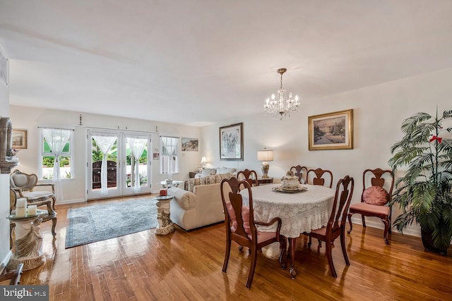 1312 Cedar Park Rd, Annapolis, MD 21401 - dining area with a chandelier and wood finished floors