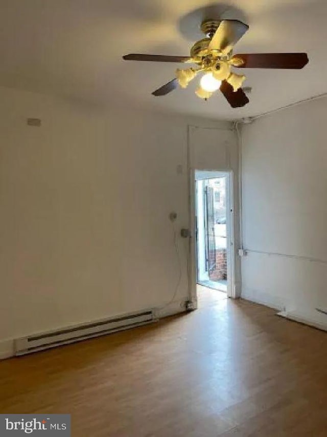 1720 1st St NW, Washington, DC 20001 - empty room featuring a baseboard radiator, ceiling fan, and wood finished floors