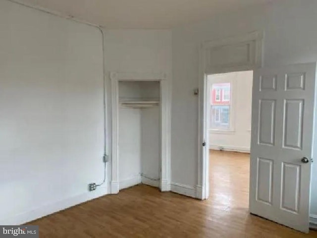 1720 1st St NW, Washington, DC 20001 - unfurnished bedroom featuring wood finished floors and a closet