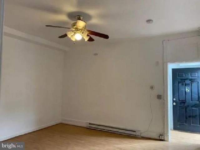 1720 1st St NW, Washington, DC 20001 - empty room featuring a baseboard heating unit and ceiling fan