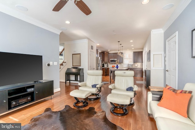 6139 Sligo Mill Rd NE, Washington, DC 20011 - living area featuring stairway, ceiling fan, ornamental molding, light wood finished floors, and recessed lighting