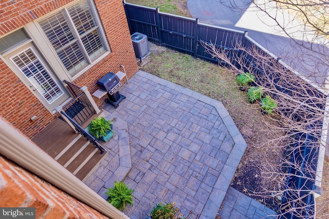 6139 Sligo Mill Rd NE, Washington, DC 20011 - fenced backyard featuring a patio area and central AC unit