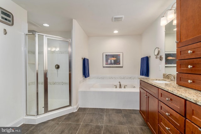 6139 Sligo Mill Rd NE, Washington, DC 20011 - bathroom featuring vanity, a bath, tile patterned floors, a shower stall, and recessed lighting