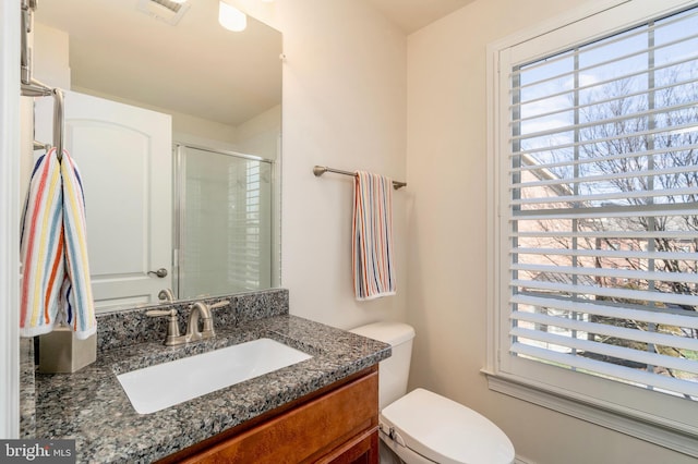 6139 Sligo Mill Rd NE, Washington, DC 20011 - bathroom with plenty of natural light, a stall shower, toilet, and vanity