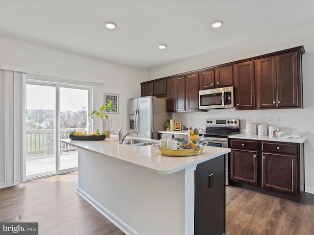 251 Magellan Dr, Martinsburg, WV 25404 - kitchen featuring stainless steel appliances, an island with sink, wood finished floors, dark brown cabinetry, and recessed lighting