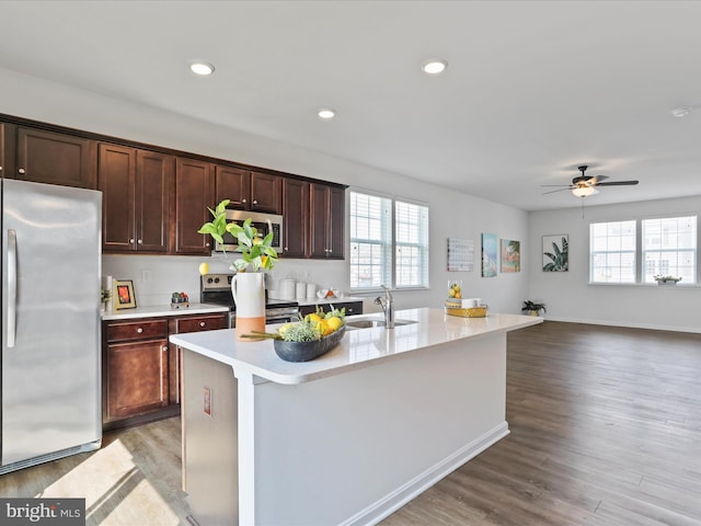 251 Magellan Dr, Martinsburg, WV 25404 - kitchen featuring appliances with stainless steel finishes, plenty of natural light, light countertops, light wood-style flooring, and recessed lighting