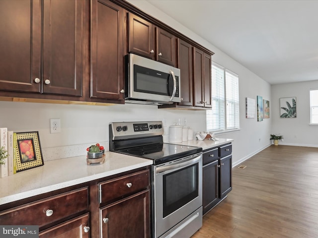 251 Magellan Dr, Martinsburg, WV 25404 - kitchen featuring stainless steel appliances, dark wood finished floors, and dark brown cabinets