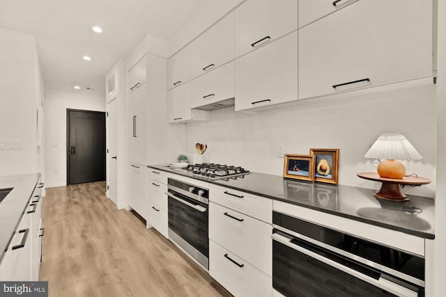 1500 Harry Thomas Way NE Unit 504, Washington, DC 20002 - kitchen featuring appliances with stainless steel finishes, white cabinetry, light wood-style flooring, recessed lighting, and modern cabinets