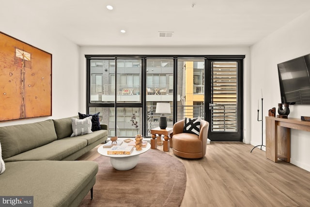1500 Harry Thomas Way NE Unit 504, Washington, DC 20002 - living area with wood finished floors, plenty of natural light, and recessed lighting