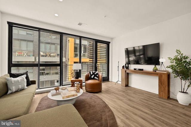 1500 Harry Thomas Way NE Unit 504, Washington, DC 20002 - living room with wood finished floors and recessed lighting