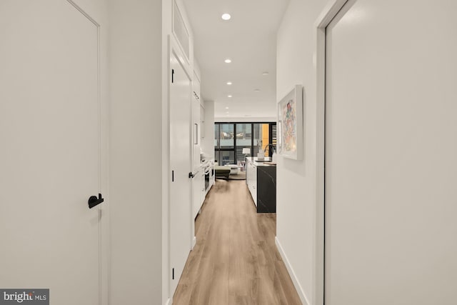 1500 Harry Thomas Way NE Unit 504, Washington, DC 20002 - hallway featuring light wood-style floors and recessed lighting