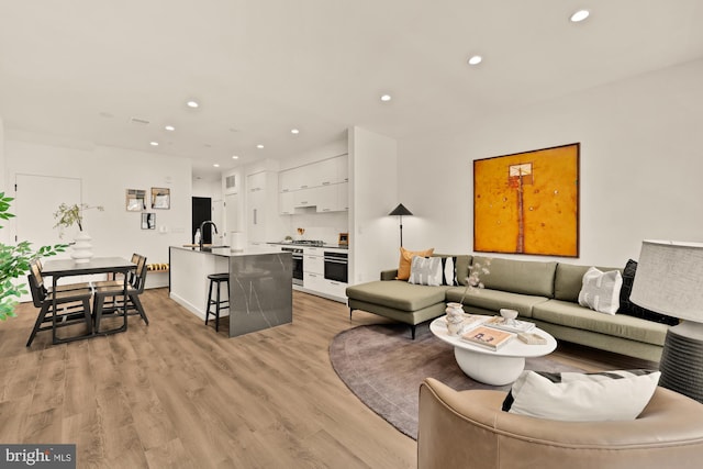 1500 Harry Thomas Way NE Unit 504, Washington, DC 20002 - living room with recessed lighting and light wood-style floors