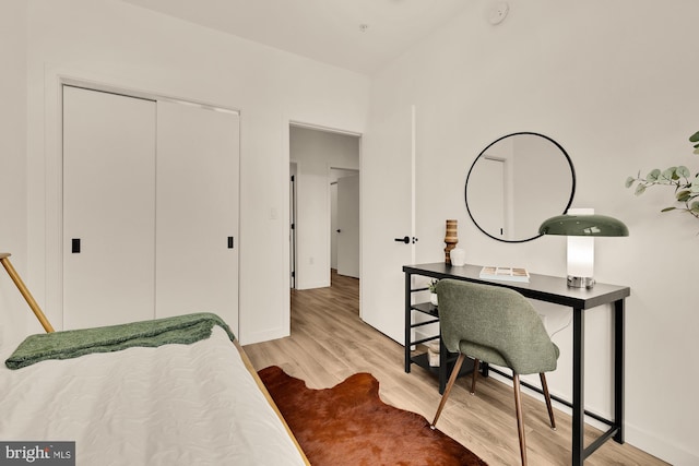 1500 Harry Thomas Way NE Unit 504, Washington, DC 20002 - bedroom with wood finished floors, an office area, and a closet