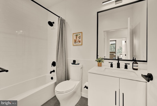 1500 Harry Thomas Way NE Unit 504, Washington, DC 20002 - bathroom featuring vanity, shower / bathtub combination with curtain, wainscoting, and tile walls