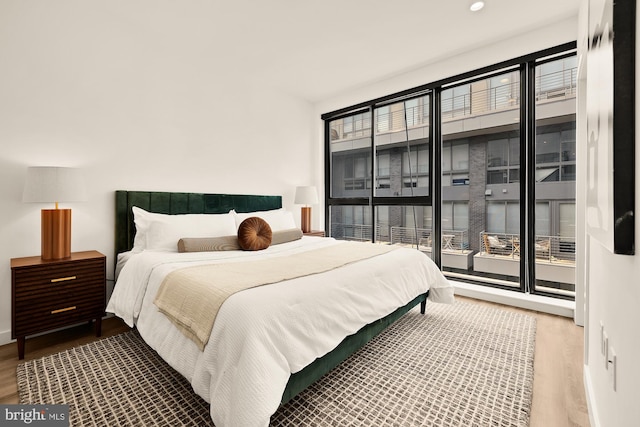 1500 Harry Thomas Way NE Unit 504, Washington, DC 20002 - bedroom with wood finished floors, multiple windows, and recessed lighting