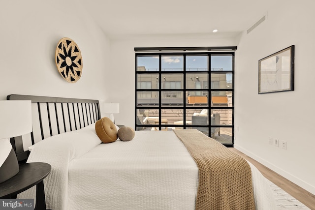 1500 Harry Thomas Way NE Unit 504, Washington, DC 20002 - bedroom featuring wood finished floors and baseboards