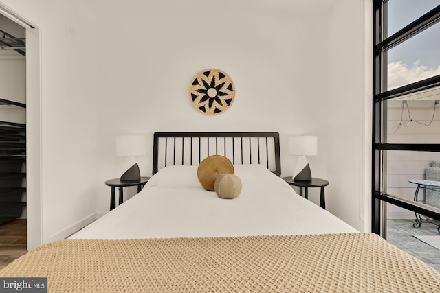 1500 Harry Thomas Way NE Unit 504, Washington, DC 20002 - bedroom featuring wood finished floors and a closet