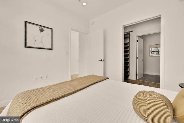 1500 Harry Thomas Way NE Unit 504, Washington, DC 20002 - bedroom featuring wood finished floors and a spacious closet