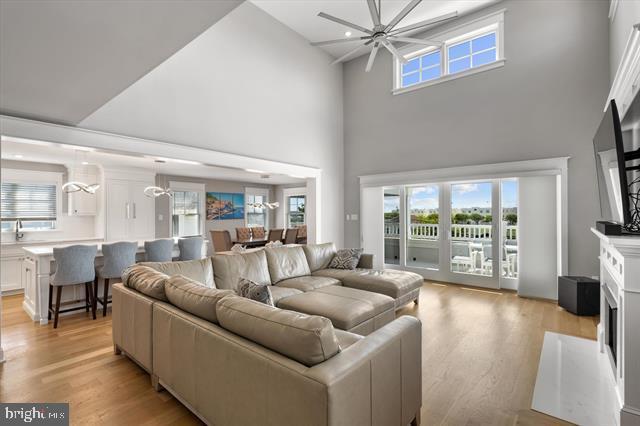 1005 Dune Dr, Avalon, NJ 08202 - living area with a towering ceiling, light wood finished floors, a ceiling fan, and healthy amount of natural light