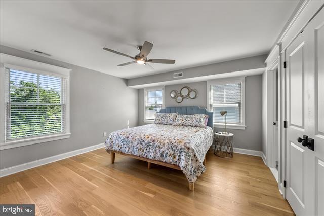 1005 Dune Dr, Avalon, NJ 08202 - bedroom with light wood-style flooring and a ceiling fan