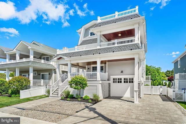 1005 Dune Dr, Avalon, NJ 08202 - beach home with a gate, a balcony, an attached garage, and a porch