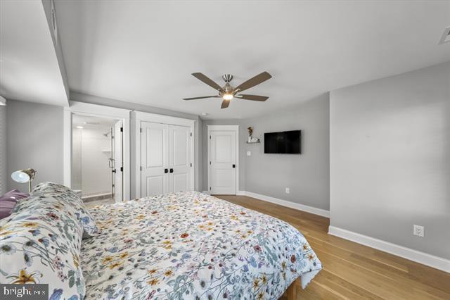 1005 Dune Dr, Avalon, NJ 08202 - bedroom with wood finished floors and a ceiling fan