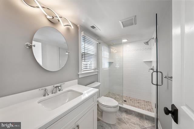 1005 Dune Dr, Avalon, NJ 08202 - full bath with a stall shower, vanity, and tile patterned floors