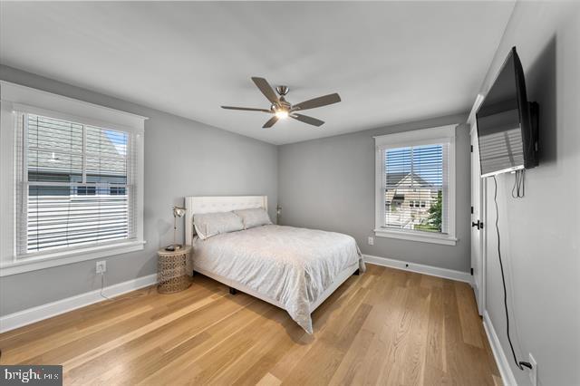 1005 Dune Dr, Avalon, NJ 08202 - bedroom with light wood-type flooring and a ceiling fan