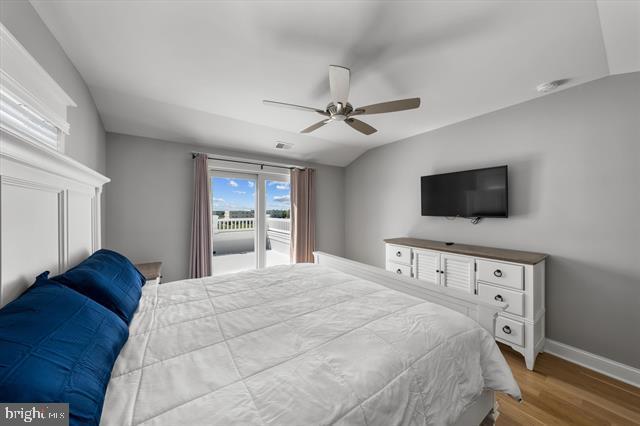 1005 Dune Dr, Avalon, NJ 08202 - bedroom featuring wood finished floors, lofted ceiling, and a ceiling fan