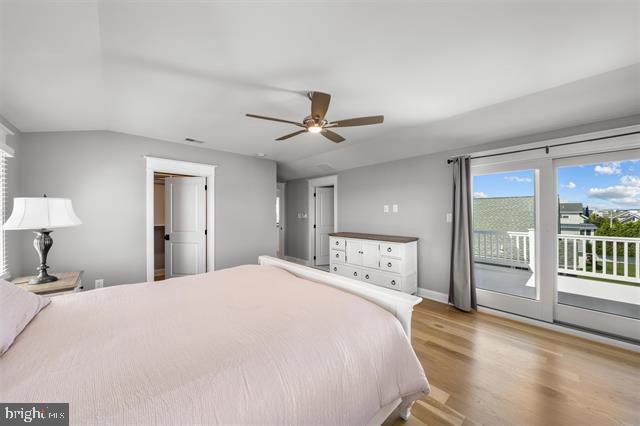 1005 Dune Dr, Avalon, NJ 08202 - bedroom featuring access to exterior, wood finished floors, lofted ceiling, and ceiling fan