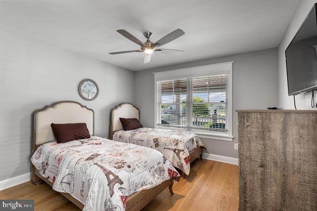 1005 Dune Dr, Avalon, NJ 08202 - bedroom with wood finished floors and a ceiling fan
