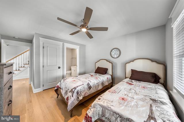 1005 Dune Dr, Avalon, NJ 08202 - bedroom featuring light wood-style floors, connected bathroom, and a ceiling fan