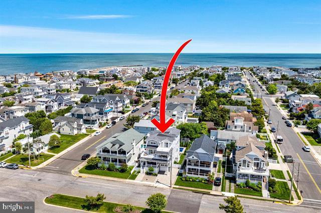 1005 Dune Dr, Avalon, NJ 08202 - aerial view of residential area with a large body of water