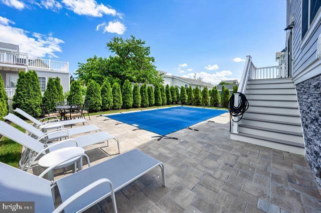 1005 Dune Dr, Avalon, NJ 08202 - view of swimming pool with a patio area and stairs