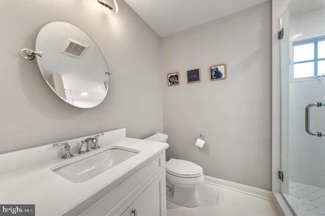 1005 Dune Dr, Avalon, NJ 08202 - full bathroom featuring vanity, a stall shower, and marble finish floors