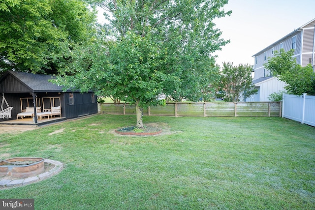 9007 Millers Island Blvd, Baltimore, MD 21219 - fenced backyard with a fire pit
