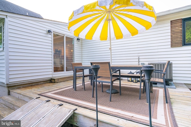 9007 Millers Island Blvd, Baltimore, MD 21219 - wooden deck featuring outdoor dining space