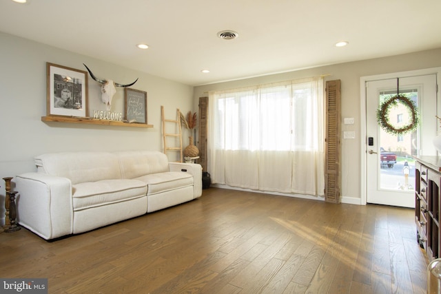 9007 Millers Island Blvd, Baltimore, MD 21219 - living area featuring wood finished floors, healthy amount of natural light, and recessed lighting