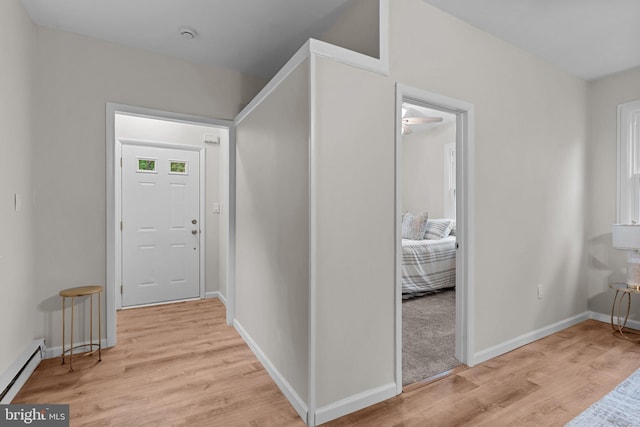72 River St, Browns Mills, NJ 08015 - foyer entrance with a baseboard heating unit and light wood-style floors