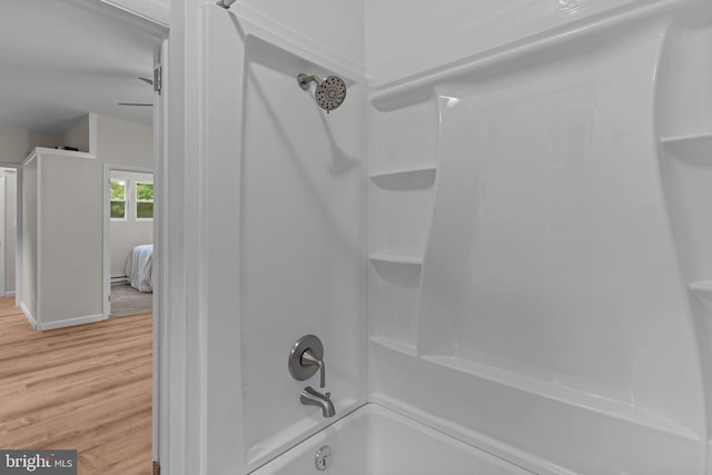 72 River St, Browns Mills, NJ 08015 - bathroom with wood finished floors and shower / washtub combination